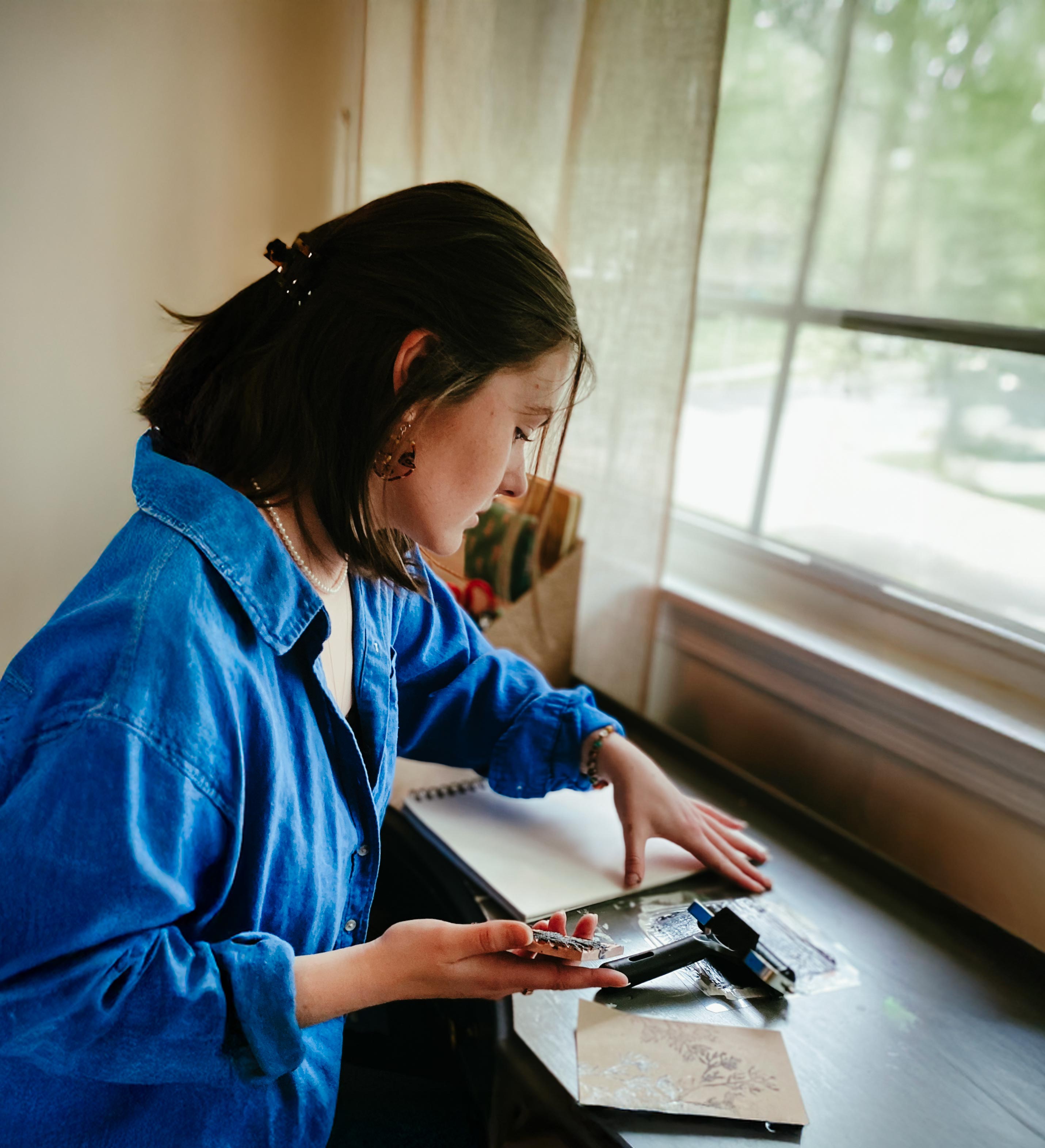 Claire Williams working at a desk